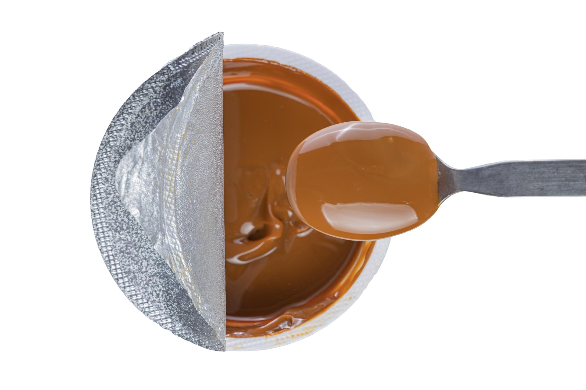 close-up of glossy caramel technique on spoon